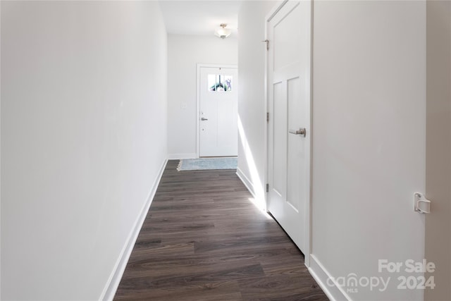 corridor featuring dark hardwood / wood-style floors