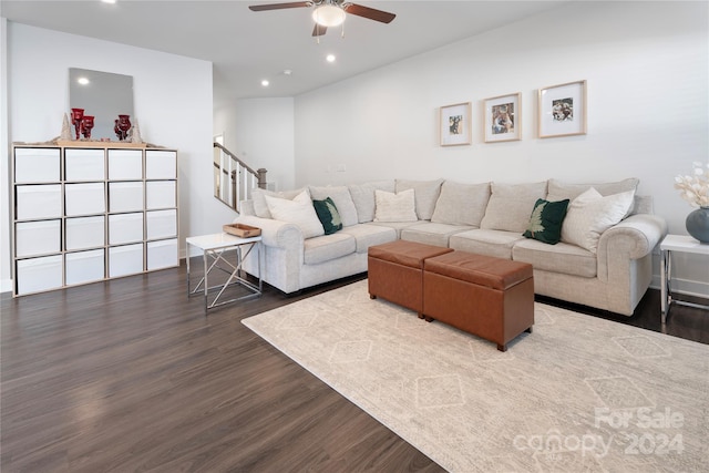 living room with ceiling fan and dark hardwood / wood-style floors