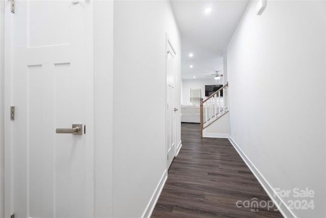 hallway featuring dark hardwood / wood-style flooring