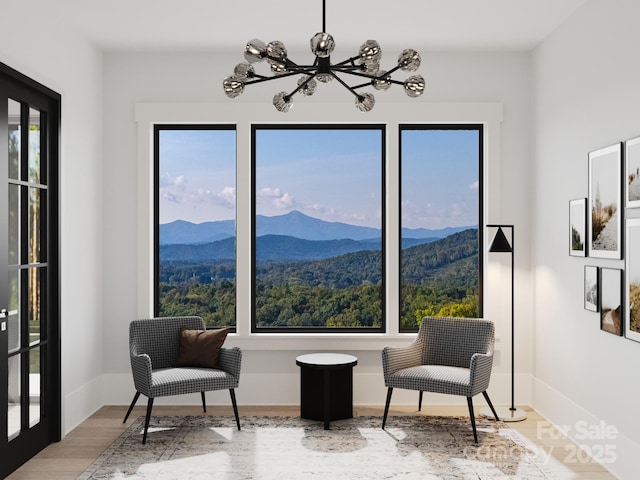 3 Bridgeway Dr Unit 38, Candler, NC 28715 - living area with a chandelier, wood finished floors, and a mountain view