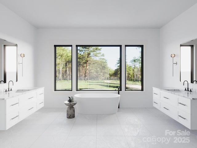 3 Bridgeway Dr Unit 38, Candler, NC 28715 - bathroom with healthy amount of natural light, two vanities, and a soaking tub