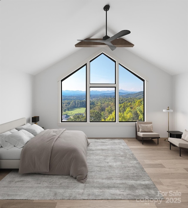 3 Bridgeway Dr Unit 38, Candler, NC 28715 - bedroom with wood finished floors, vaulted ceiling, and ceiling fan