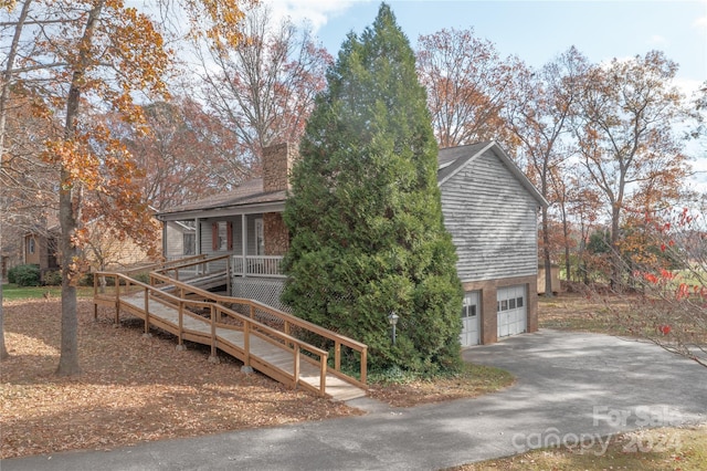 view of front of house with a porch and a garage