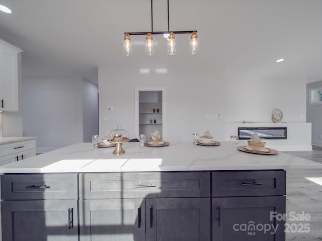 bathroom featuring hardwood / wood-style floors and built in shelves