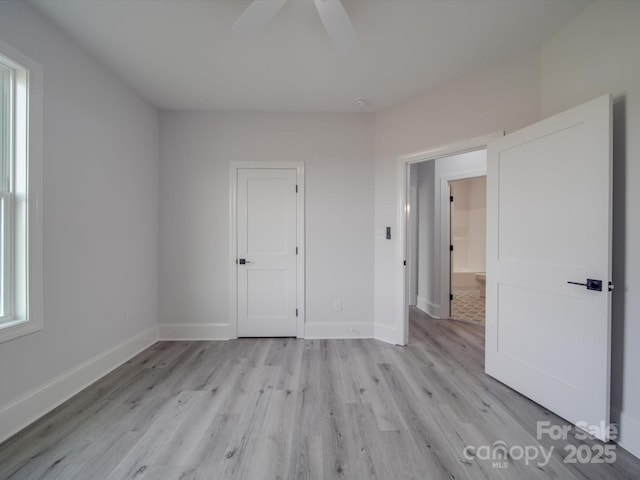 unfurnished bedroom featuring light hardwood / wood-style flooring and ceiling fan