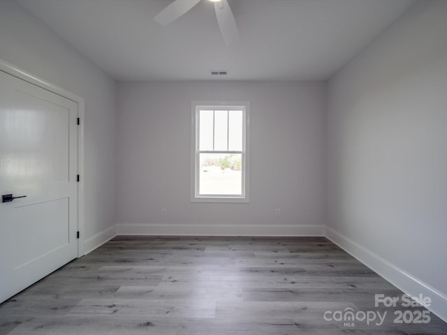 unfurnished room featuring ceiling fan and light hardwood / wood-style flooring