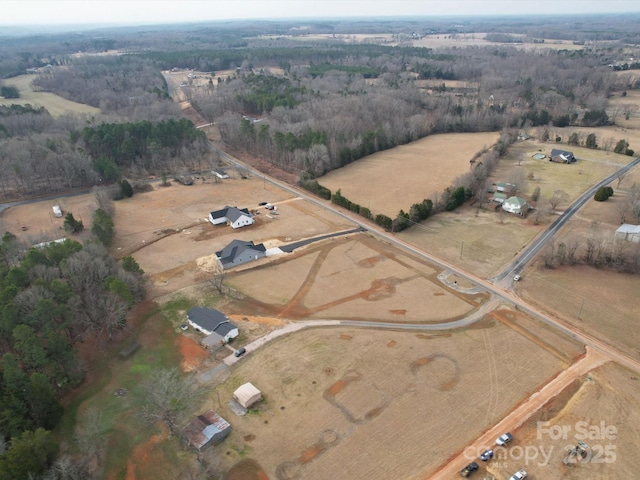 birds eye view of property featuring a rural view