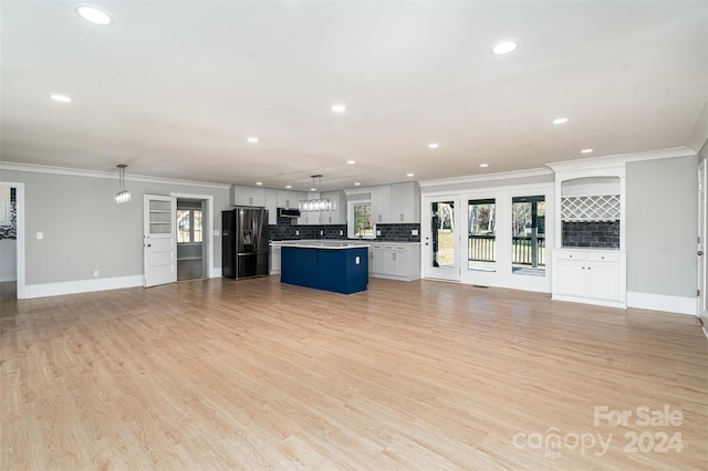 3700 Pinecrest Dr, Gastonia, NC 28056 - unfurnished living room with ornamental molding, recessed lighting, baseboards, and light wood-type flooring