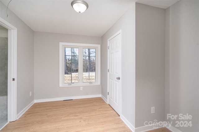 3700 Pinecrest Dr, Gastonia, NC 28056 - unfurnished bedroom featuring light wood finished floors and baseboards