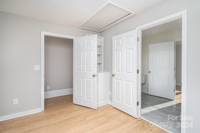 3700 Pinecrest Dr, Gastonia, NC 28056 - unfurnished bedroom with attic access, light wood-type flooring, and baseboards