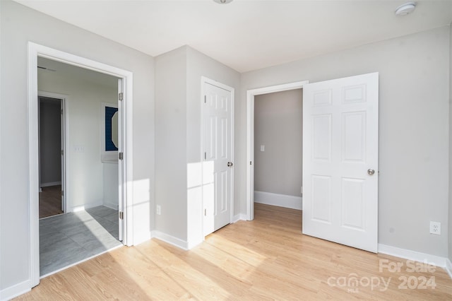 3700 Pinecrest Dr, Gastonia, NC 28056 - unfurnished bedroom with light wood-style flooring and baseboards