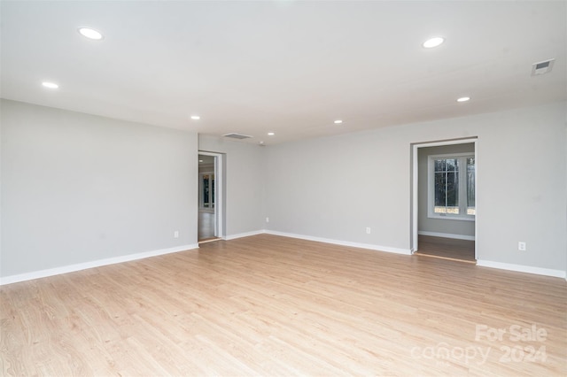 unfurnished room with light hardwood / wood-style floors