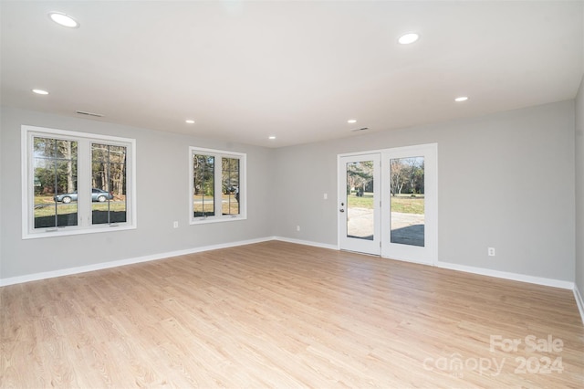 spare room featuring light hardwood / wood-style floors