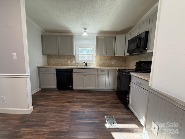 kitchen featuring black appliances, gray cabinets, sink, and dark wood-type flooring