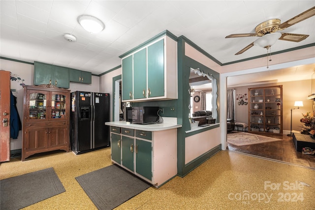 kitchen featuring ceiling fan, green cabinetry, ornamental molding, and black appliances