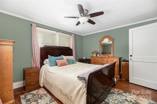 bedroom with dark hardwood / wood-style flooring, ceiling fan, and crown molding