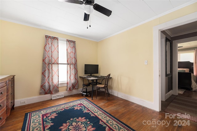 office space featuring hardwood / wood-style flooring, ceiling fan, ornamental molding, and a wealth of natural light