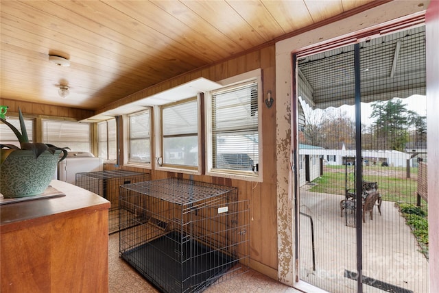 interior space with independent washer and dryer and wooden ceiling