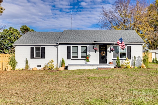 view of front of home featuring covered porch and a front yard