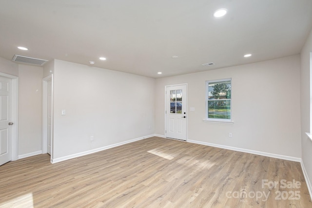 spare room featuring light wood-type flooring