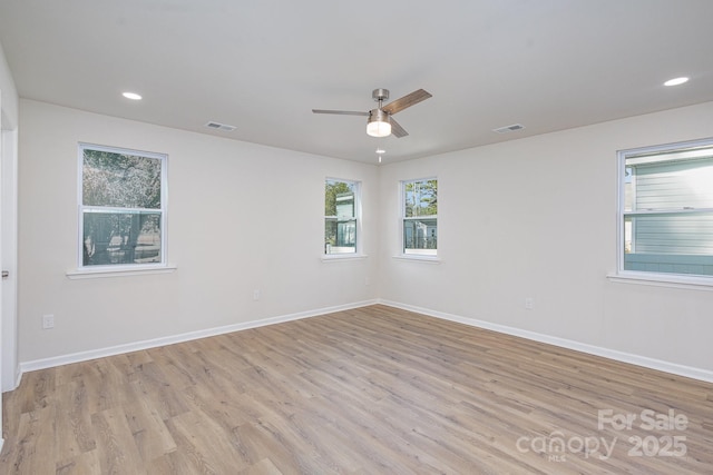 unfurnished room featuring ceiling fan and light hardwood / wood-style floors