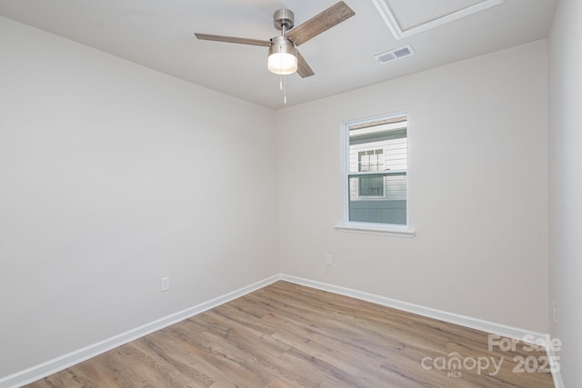 spare room featuring ceiling fan and light hardwood / wood-style flooring