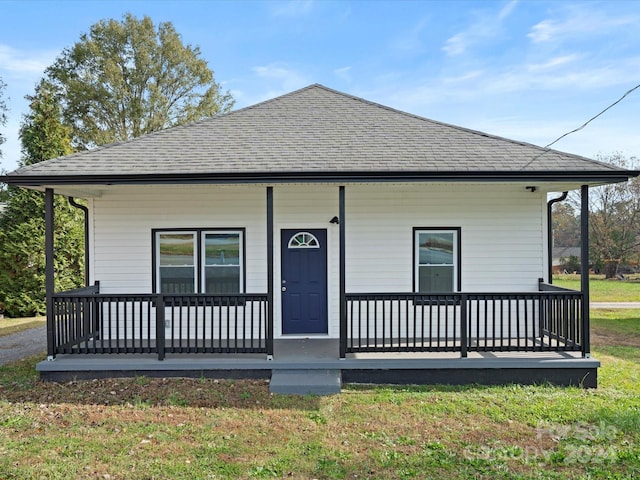 view of front of home featuring a front lawn and a porch