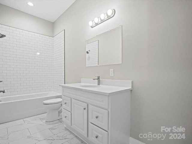 full bathroom with vanity, toilet, and tiled shower / bath