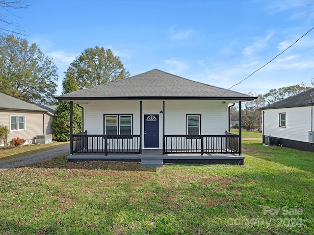 bungalow-style house with covered porch and a front yard