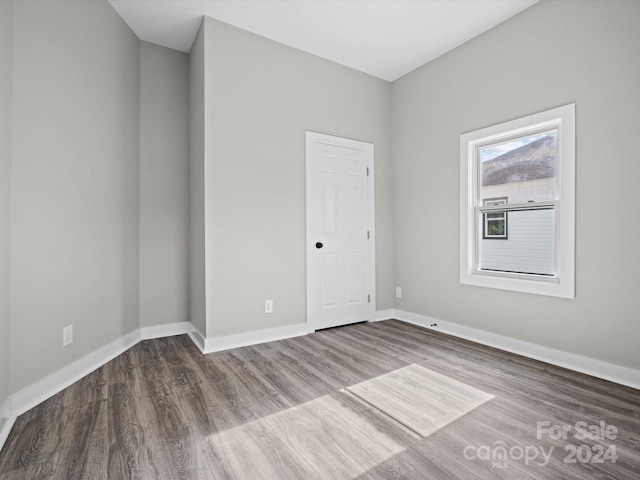 spare room featuring hardwood / wood-style floors