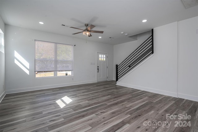 foyer entrance featuring ceiling fan and dark hardwood / wood-style floors