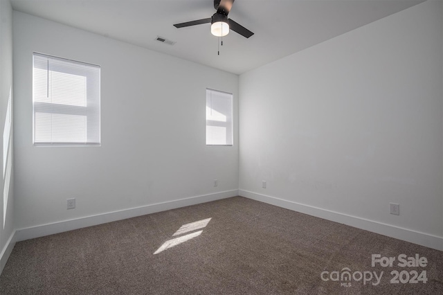 carpeted empty room with ceiling fan