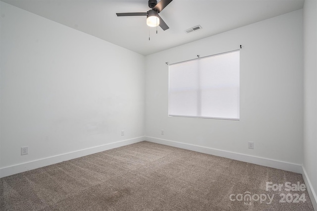 unfurnished room with ceiling fan and carpet floors