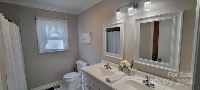 bathroom featuring vanity, toilet, and crown molding