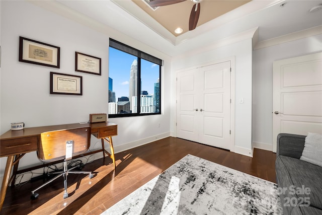 office area with dark hardwood / wood-style floors, ceiling fan, and crown molding