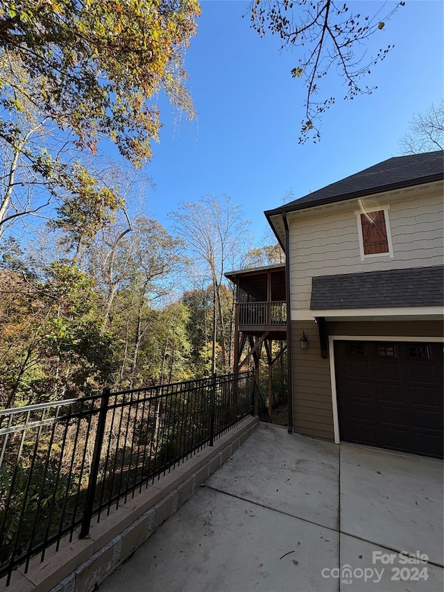 view of property exterior featuring a garage