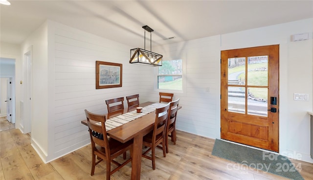 dining space featuring plenty of natural light and light hardwood / wood-style floors