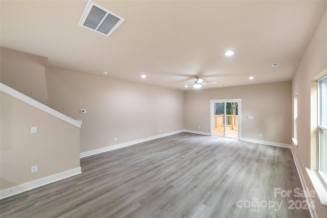 empty room featuring wood-type flooring and ceiling fan