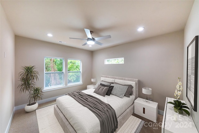 carpeted bedroom with ceiling fan