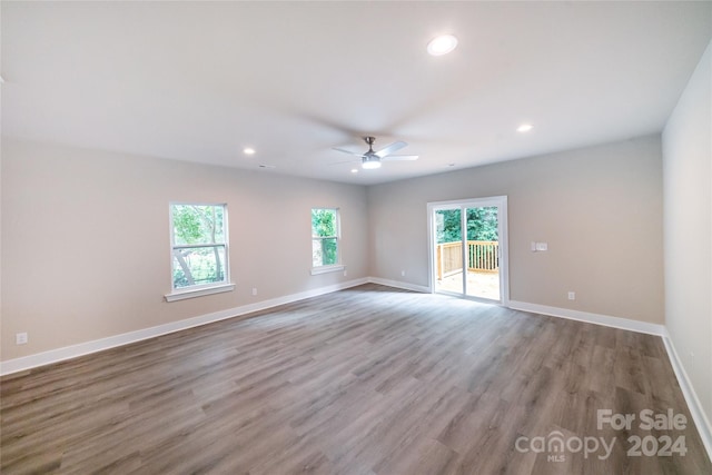 spare room featuring light hardwood / wood-style floors and ceiling fan