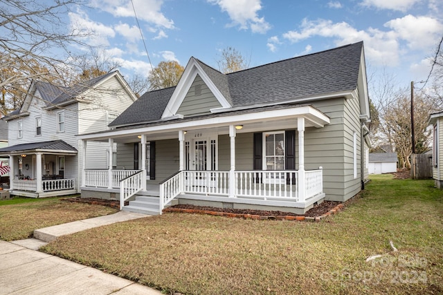 view of front of home with a porch and a front lawn