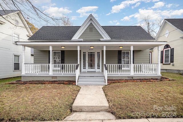 view of front facade with a front yard and a porch