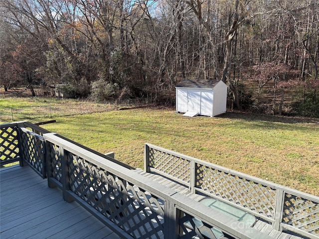 wooden terrace with a yard and a shed