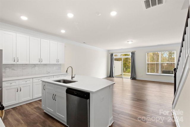 kitchen with white cabinetry, sink, stainless steel dishwasher, dark hardwood / wood-style floors, and a center island with sink