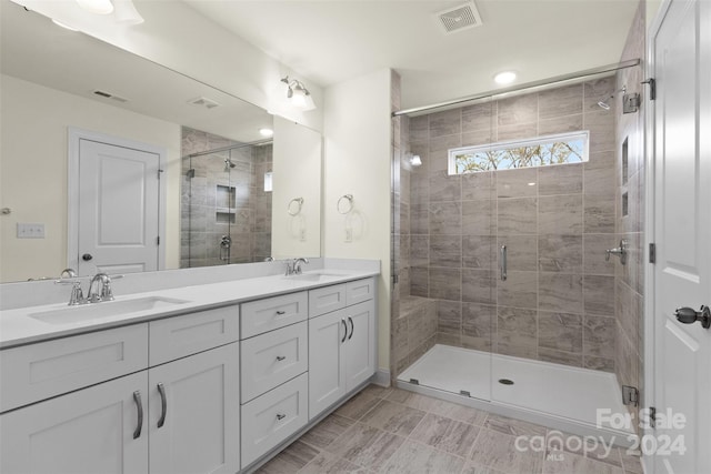 bathroom with vanity and an enclosed shower