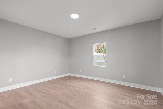 empty room with light wood-type flooring