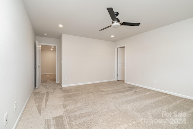 carpeted empty room with ceiling fan