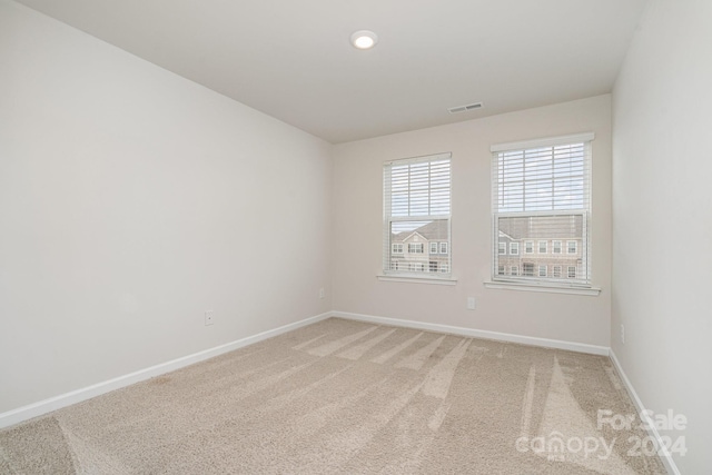 spare room featuring carpet flooring