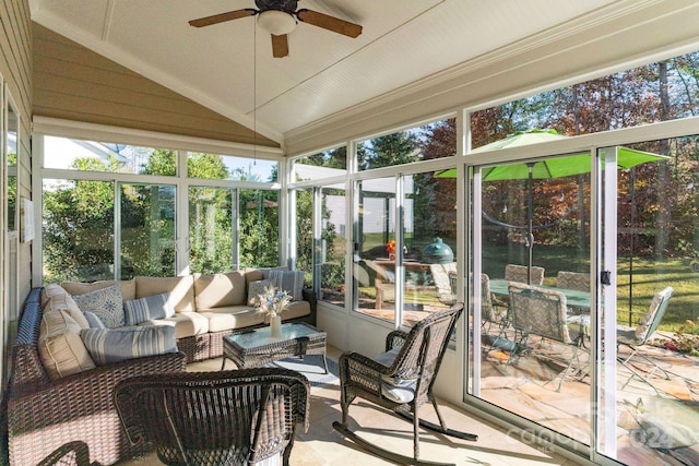 sunroom featuring ceiling fan and lofted ceiling