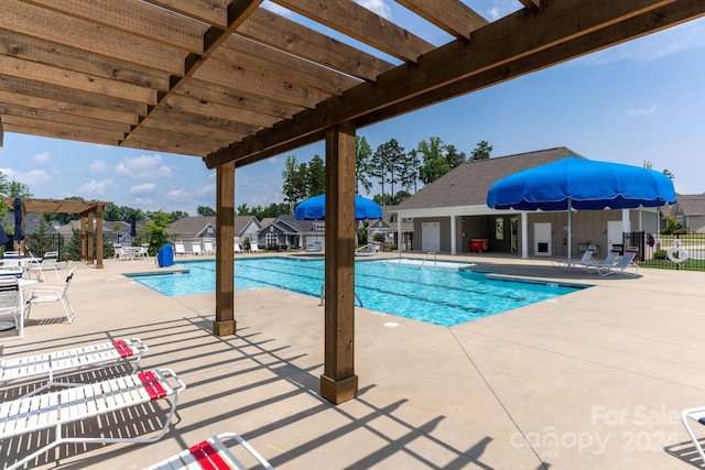 view of pool featuring a patio area and a pergola